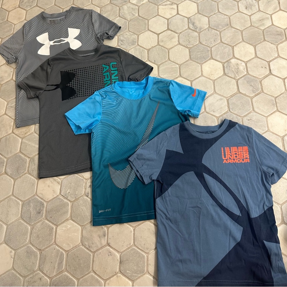 4  XS boys under armor and Nike T-shirts